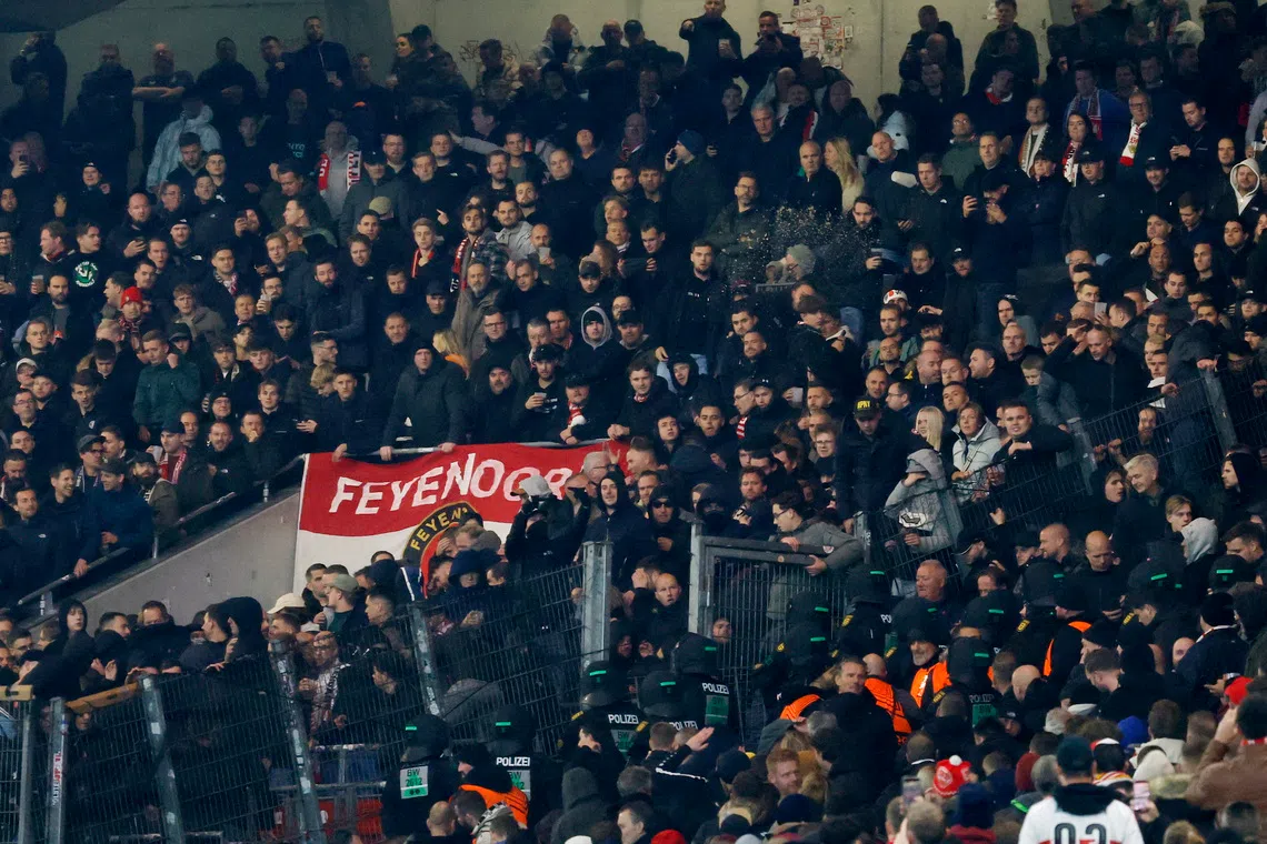 Soccer Football - UEFA Europa League - VfB Stuttgart v Feyenoord - MHPArena, Stuttgart, Germany - November 6, 2025 General view of police officers with fans in the stands REUTERS/Heiko Becker