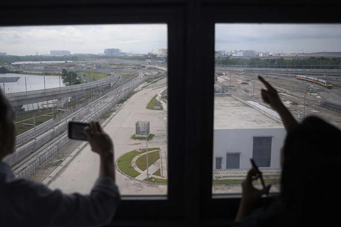 Visitors get an overview of the the Performance and Integration Test Track (far left) and Endurance Test Track (second from left), at the Singapore Rail Test Centre are seen during the official opening ceremony on March 28, 2025.