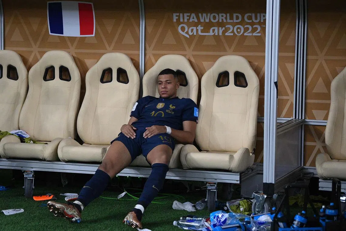 France's forward Kylian Mbappe reacts after losing in the penalty shoot-out of the Qatar 2022 World Cup football final match between Argentina and France.