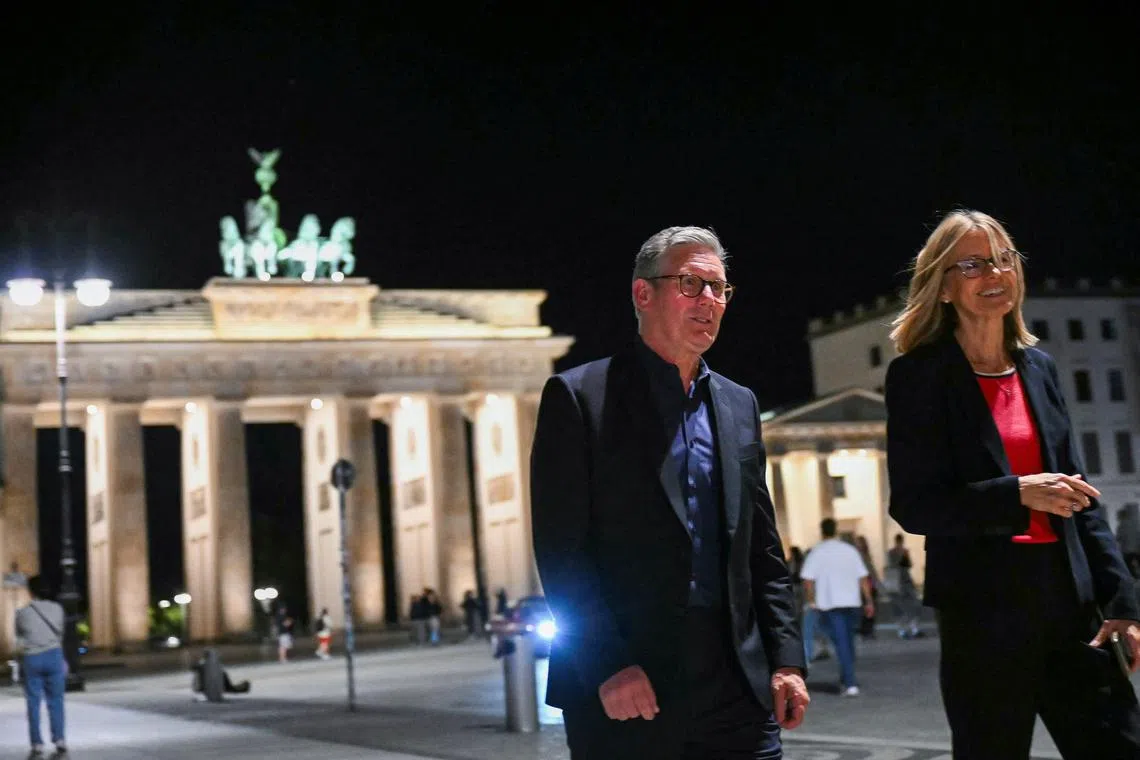 Britain's Prime Minister Keir Starmer and British Ambassador to Germany Jill Gallard walk near the Brandenburg Gate in Berlin, Germany August 27, 2024.     JUSTIN TALLIS/Pool via REUTERS