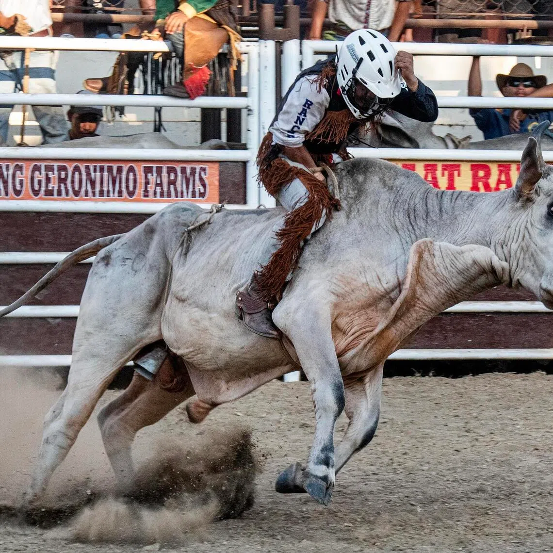 A bull rider tries to balance on top of a raging bull during Rodeo Masbateno on April 14 in Masbate, Philippines.