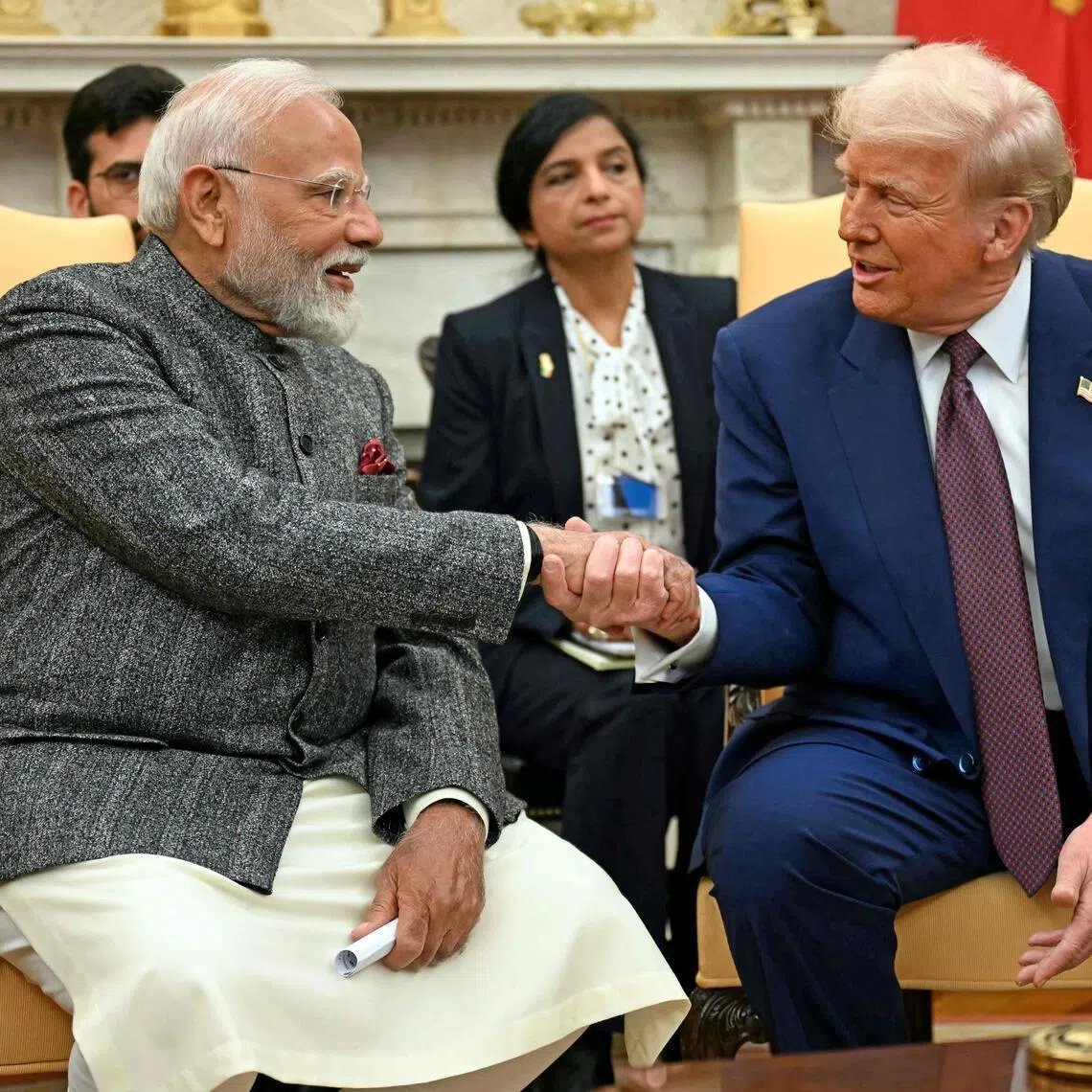 US President Donald Trump shakes hands with Indian Prime Minister Narendra Modi at the White House in Washington, DC, on Feb 13, 2025. PHOTO: AFP