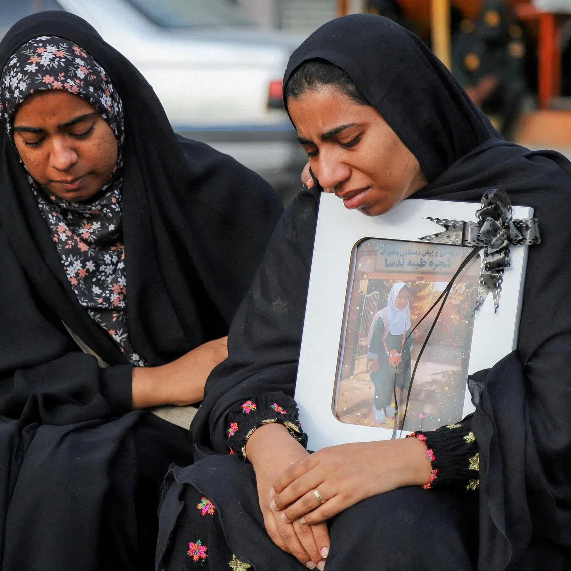 FILE PHOTO: People mourn on the day of the funeral of the victims following a reported strike on a school in Minab, Iran, March 3, 2026. Amirhossein Khorgooei/ISNA/WANA (West Asia News Agency) via REUTERS/File Photo