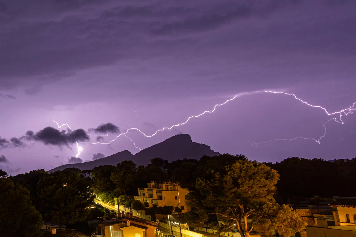 epa13245060 A thunderstorm over the town of Sant Elm, Majorca Island, eastern Spain, 17 September 2006. Heavy rainfall hit eastern Spain. EPA/CATI CLADERA