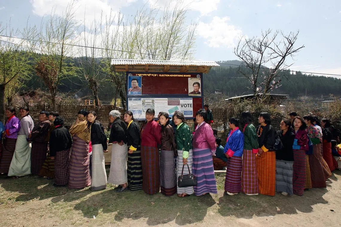 Bhutan has around 800,000 people and lies sandwiched between the two most populous countries, China and India.