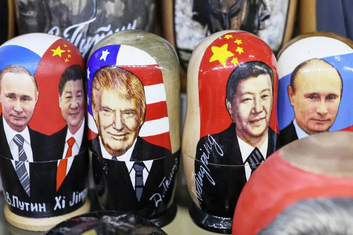 epa11892743 Traditional Russian wooden dolls Matryoshka depicting Russian President Vladimir Putin and US President Donald Trump are displayed for sale at a souvenir shop in Moscow, Russia, 13 February 2025. Russia has begun preparing a negotiating group to organize a meeting between the presidents of Russia and the United States, Russian presidential press secretary Dmitry Peskov said. The day before, Putin and Trump had a telephone conversation.  EPA-EFE/MAXIM SHIPENKOV