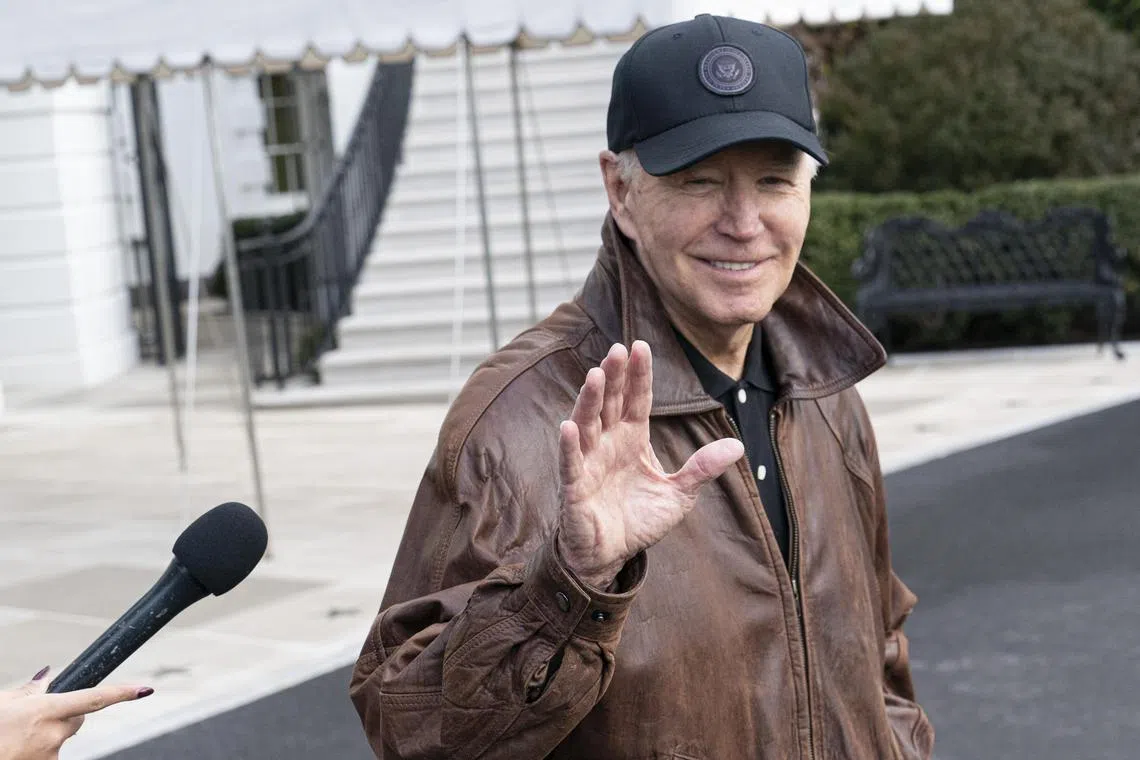 US President Joe Biden speaks to members of the media on the South Lawn of the White House before boarding Marine One in Washington.