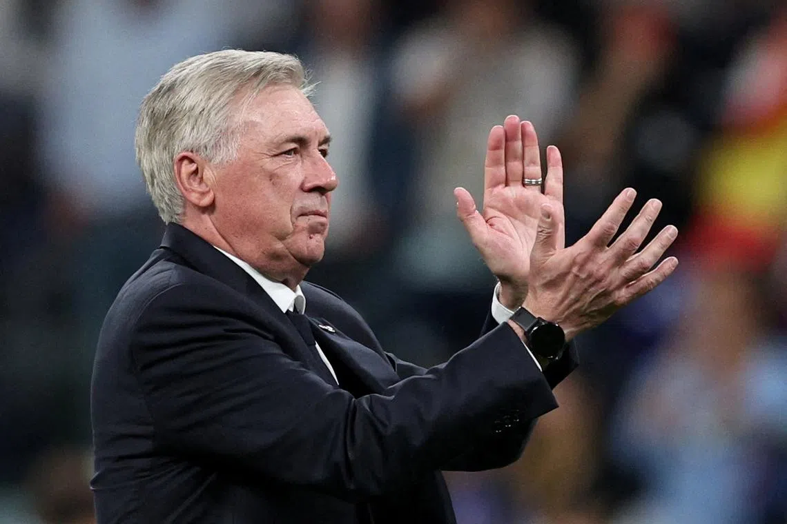 FILE PHOTO: Soccer Football - Champions League - Semi Final - Second Leg - Real Madrid v Bayern Munich - Santiago Bernabeu, Madrid, Spain - May 8, 2024  Real Madrid coach Carlo Ancelotti celebrates after the match REUTERS/Violeta Santos Moura/File Photo