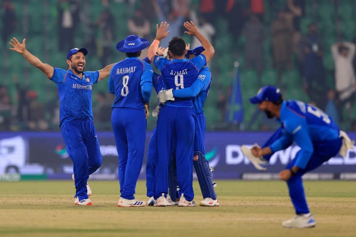 Cricket - ICC Men's Champions Trophy - Group B - England v Afghanistan - Gaddafi Stadium, Lahore, Pakistan - February 26, 2025 Afghanistan players celebrate after winning the match REUTERS/Akhtar Soomro