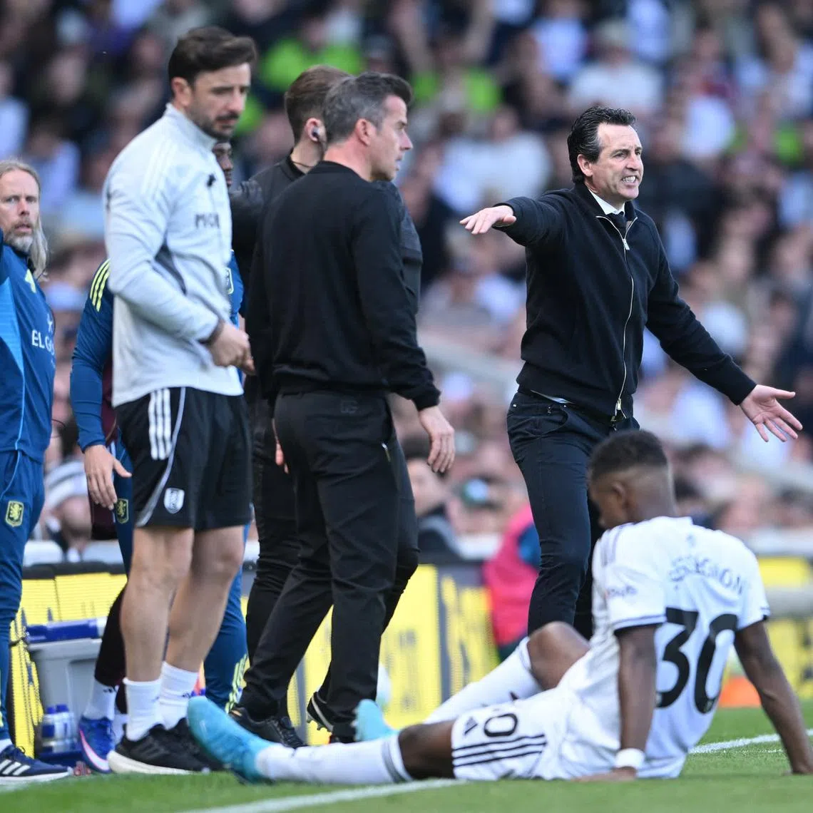 Soccer Football - Premier League - Fulham v Aston Villa - Craven Cottage, London, Britain - April 25, 2026 Aston Villa manager Unai Emery reacts as Fulham manager Marco Silva looks on REUTERS/Jaimi Joy