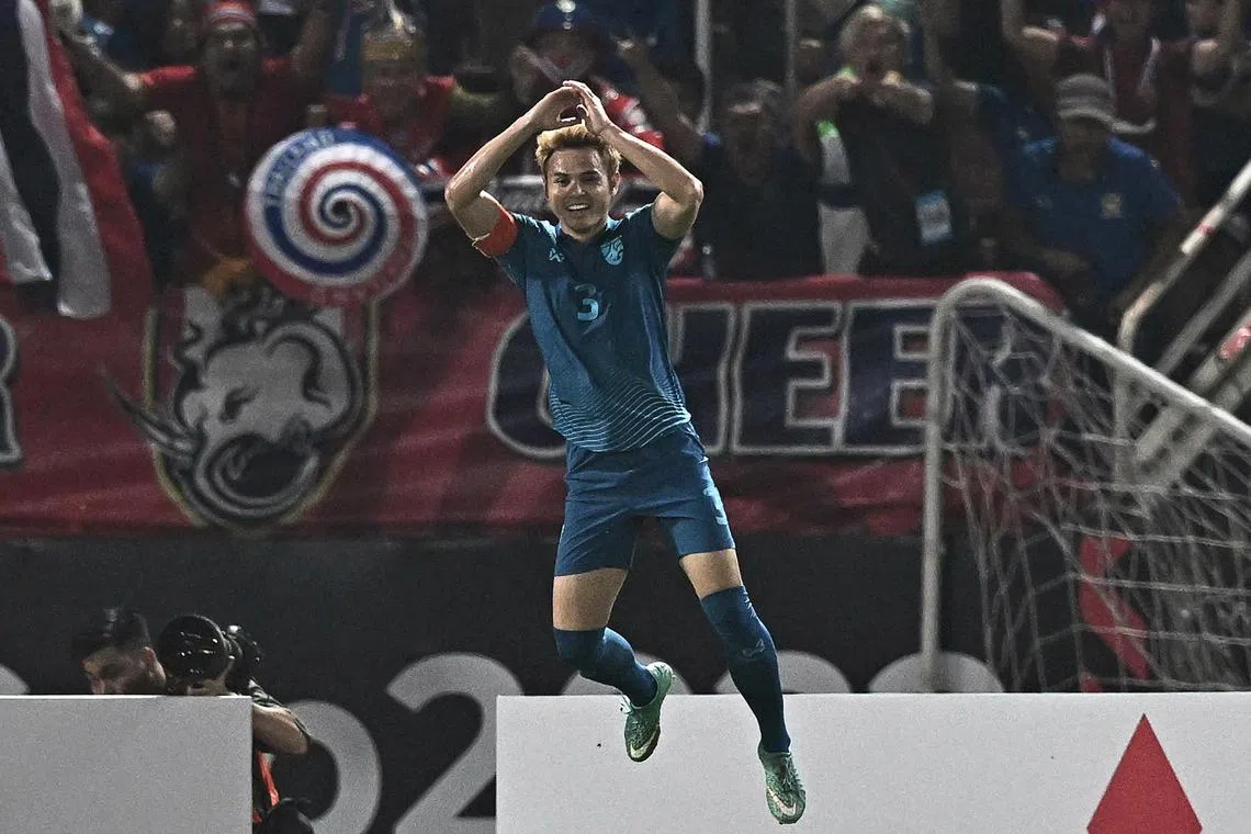 Thailand's Theerathon Bunmathan celebrates after scoring against Vietnam in the second leg of the AFF Championship final on Monday.