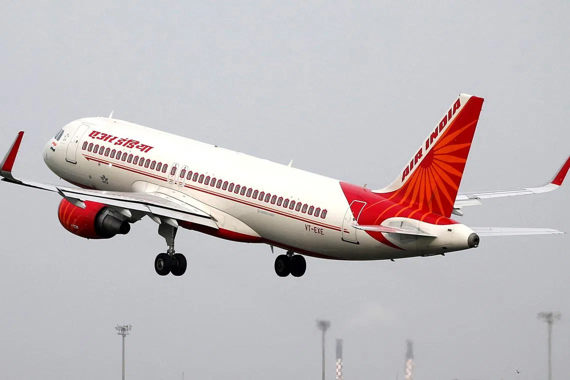 FILE PHOTO: An Air India Airbus A320-200 aircraft takes off from the Sardar Vallabhbhai Patel International Airport in Ahmedabad, India, July 7, 2017. Picture taken July 7, 2017/REUTERS/Amit Dave/File Photo