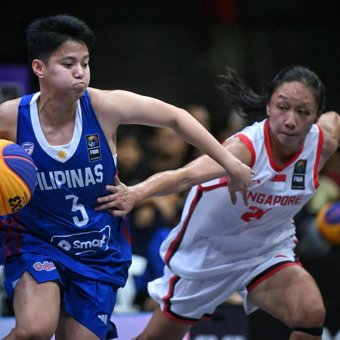 Singapore's Jermaine Lim (right) taking on Afril Benardino of the Philippines who won 21-10 to earn Fiba 3x3 World Cup qualification.