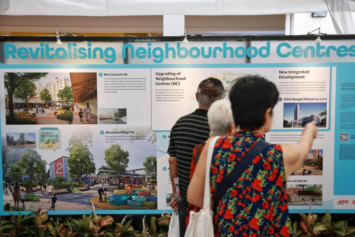 Residents looking at rejuvenation plans for their estate at the Remaking of Heartland exhibition in Bukit Merah Town Centre on Sept 17, 2023.