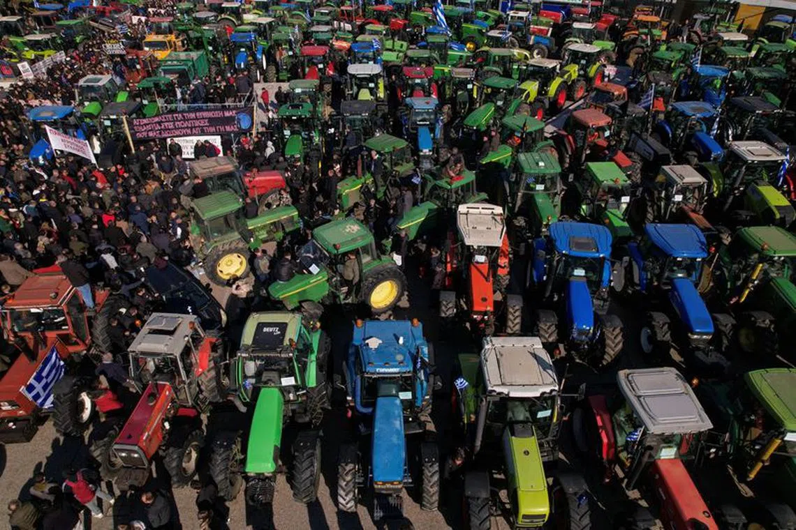 Tractors are parked outside Thessaloniki’s International Fair during a Greek farmers’ protest against higher energy costs, lower state subsidies as well as demanding compensations from the recent floods, in Thessaloniki, Greece, February 3, 2024. REUTERS/Alexandros Avramidis/file photo