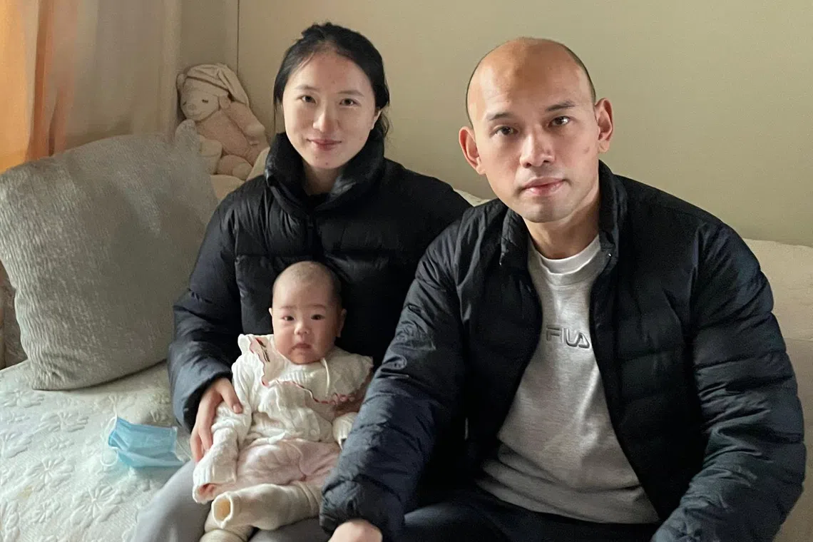 Mr Tan Kok Kuan, with his wife Gu Yundan and son Chen Zhuoyuan, has started wearing N95 masks to protect himself and his family.