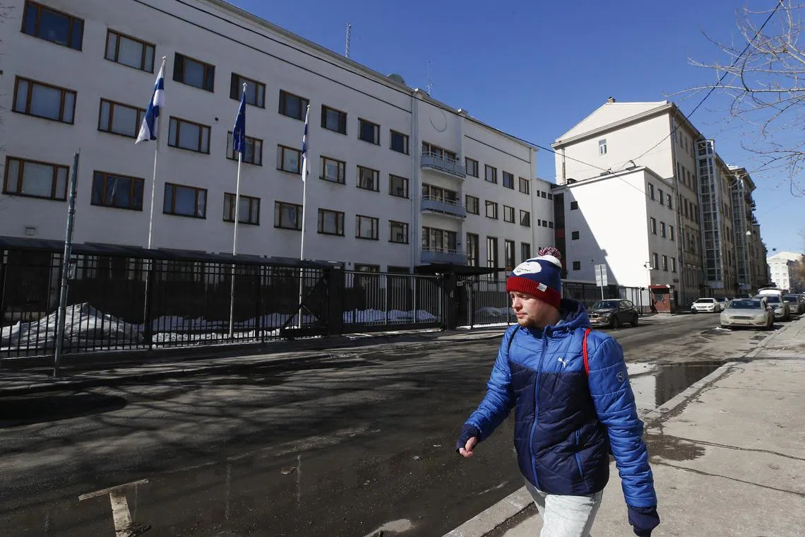 FILE PHOTO: A man walks along a street near the embassy of Finland in Moscow, Russia March 29, 2018. REUTERS/Maxim Shemetov/File Photo