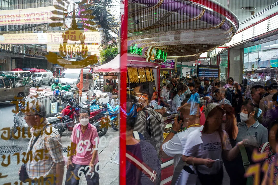 Customers queueing at a gold shop in Bangkok's Chinatown, Thailand, on Oct 9, 2025. 