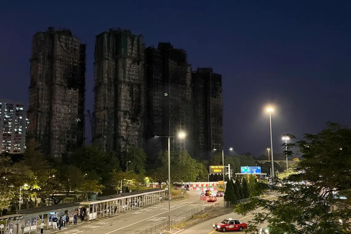 mfletter22 - As the sun sets and the lights come on in Hong Kong on Dec 17, 2025, the dark outlines of the charred towers of Wang Fuk Court look particularly stark, brutal even, against the Tai Po skyline, as if determined to remind every passer-by of the city’s recent sorrow.
ST PHOTO: MAGDALENE FUNG