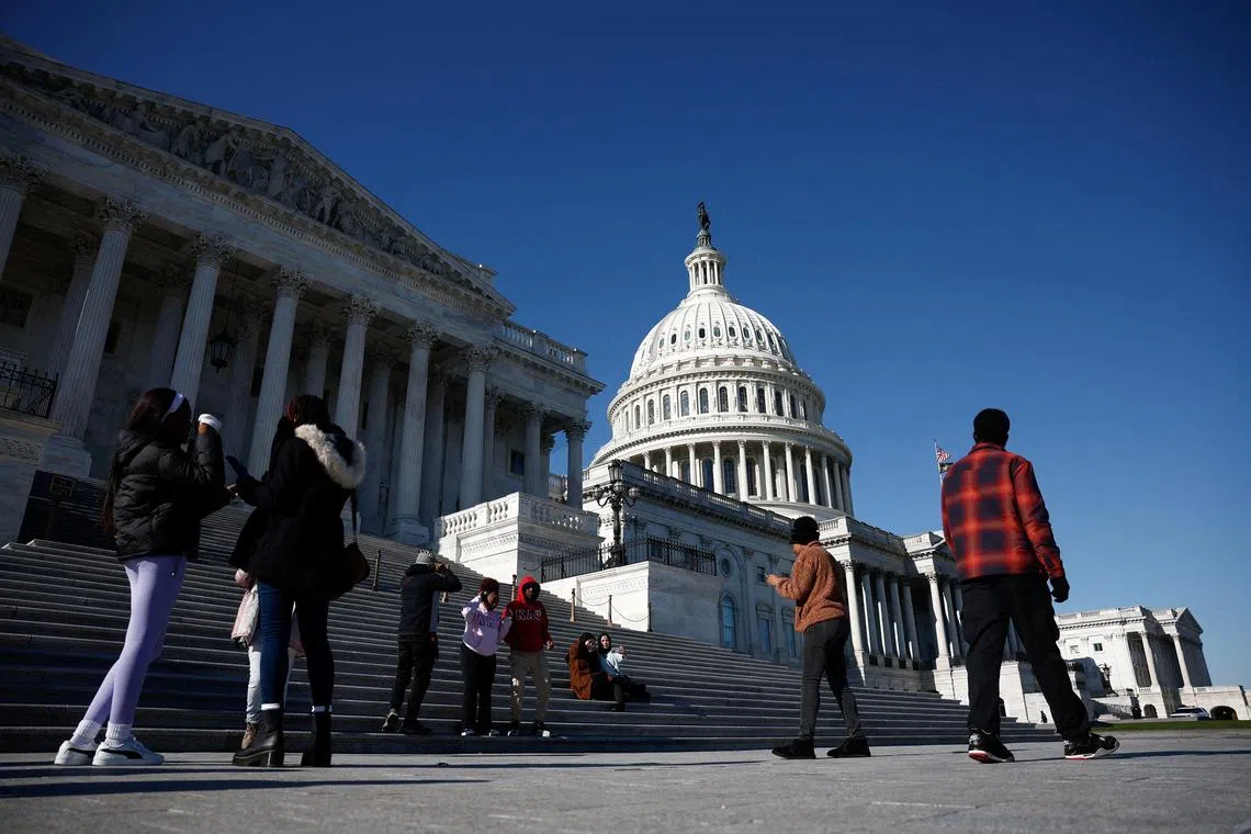 FILE PHOTO: People walk near the U.S. Capitol in Washington, D.C., U.S., December 2, 2024. REUTERS/Benoit Tessier/File Photo