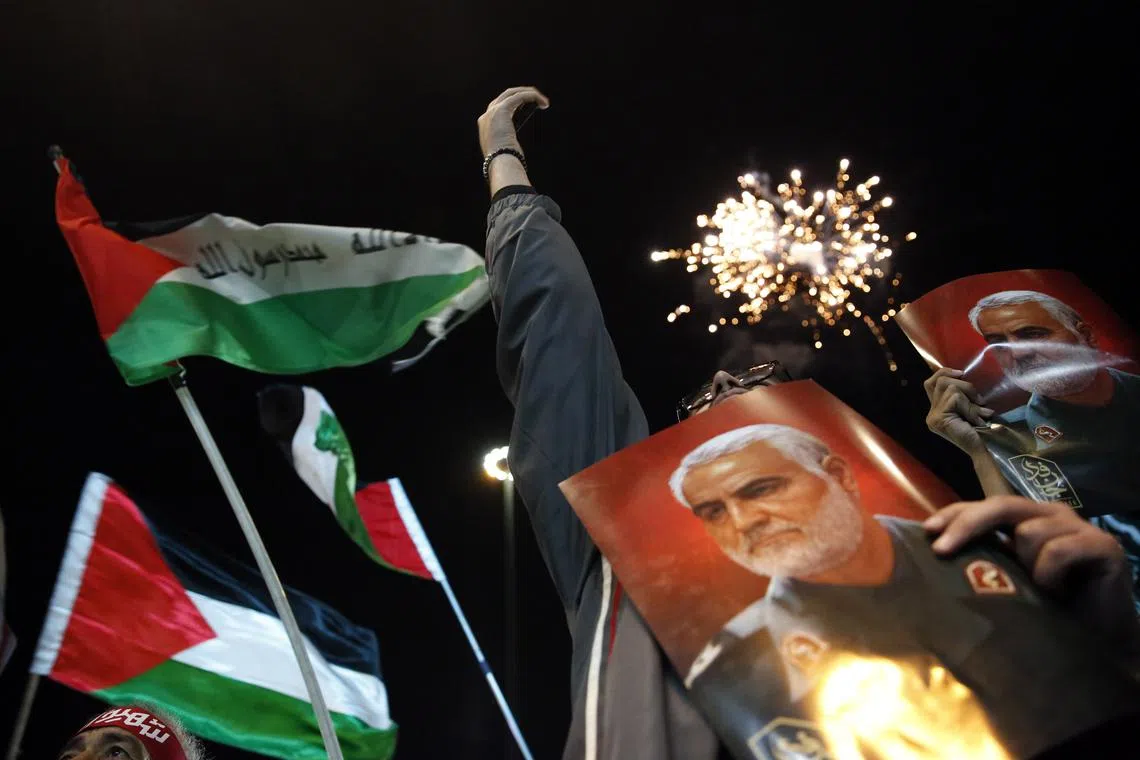 Iranian supporters of Hezbollah waving Palestinian flags during a celebration of the Hamas attacks in Israel, at a rally in Teheran on Oct 7.