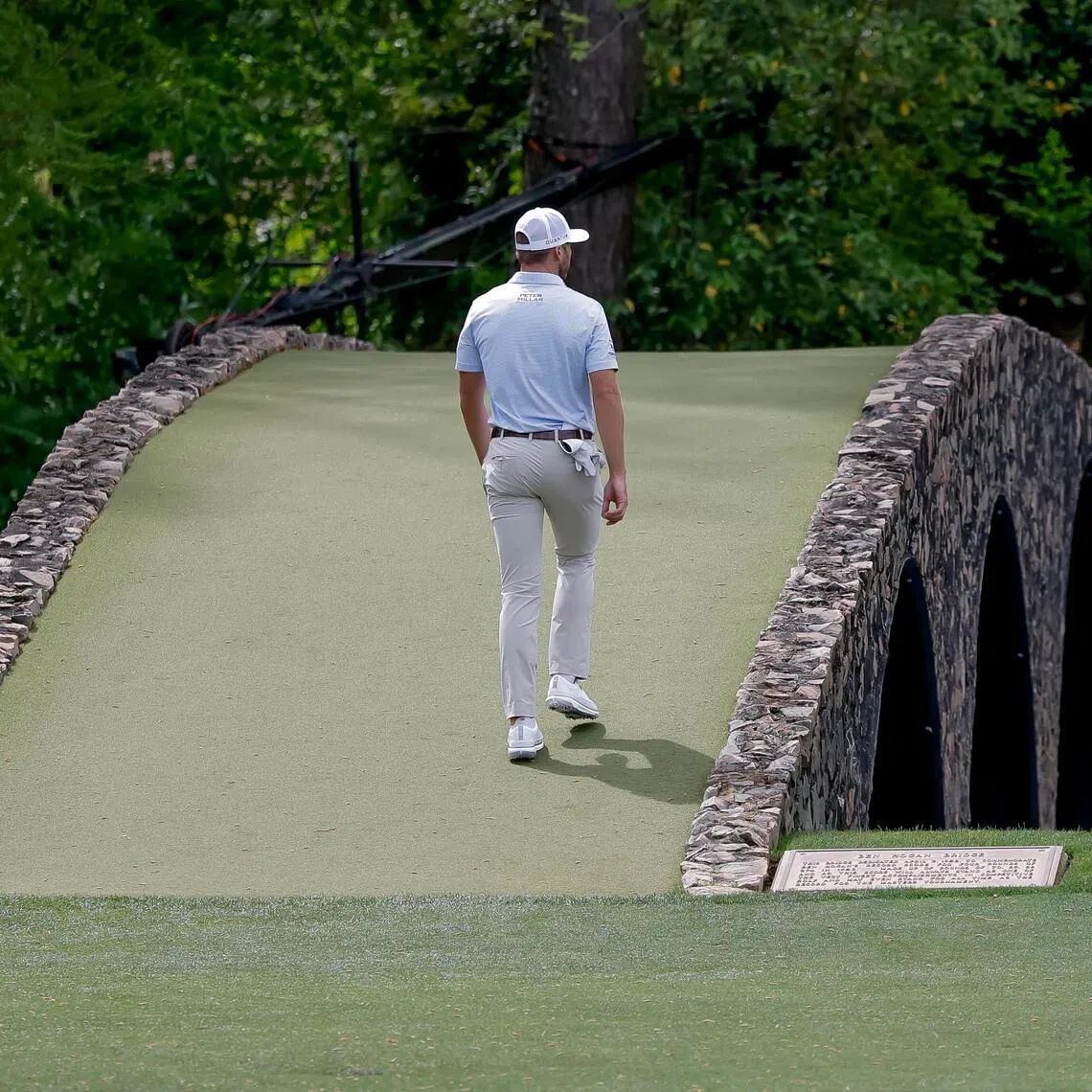 BRIDGING GENERATIONS: American player Sam Burns crosses the Hogan Bridge at Augusta National which was dedicated to the legendary golfer Ben Hogan in 1958. 