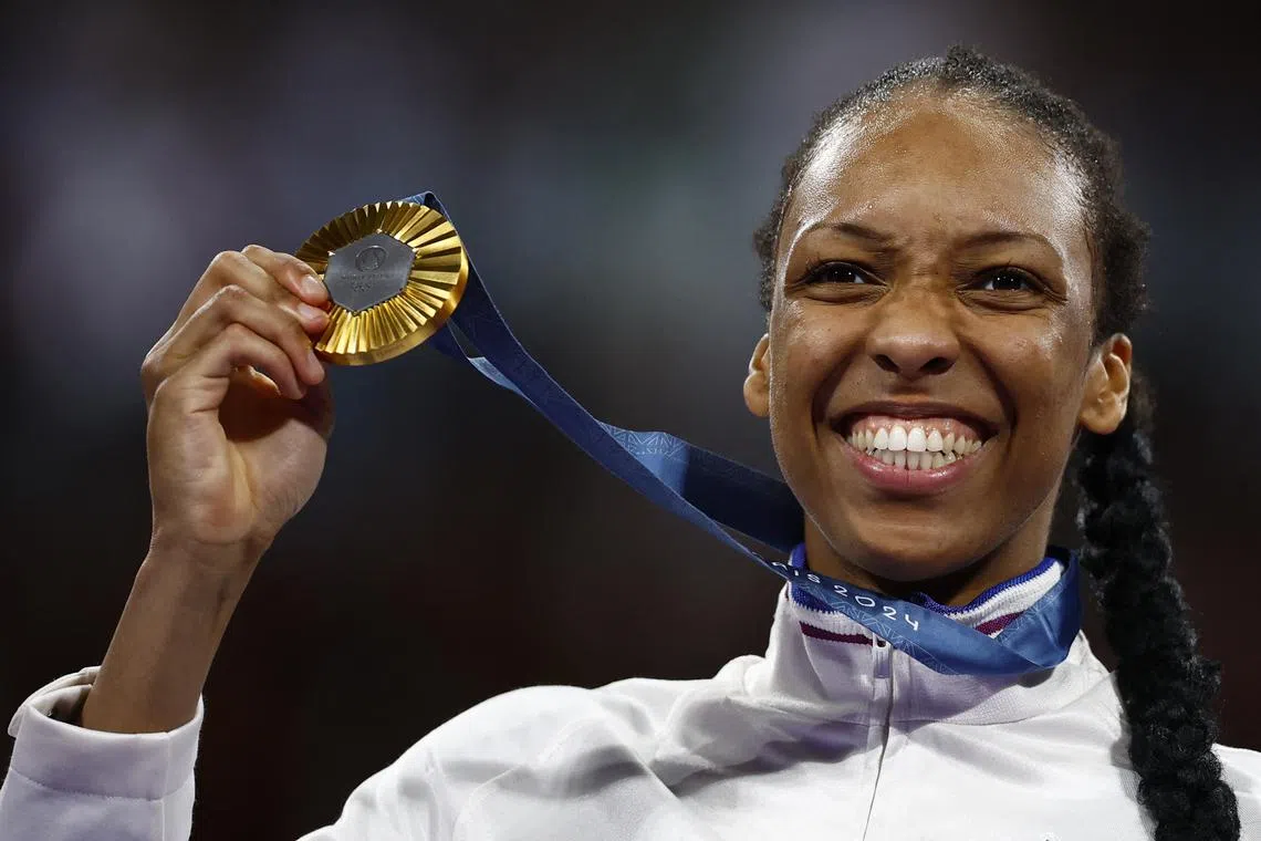 Paris 2024 Olympics - Taekwondo - Women +67kg Victory Ceremony - Grand Palais, Paris, France - August 10, 2024. Gold medallist Althea Laurin of France poses with her medal. REUTERS/Albert Gea