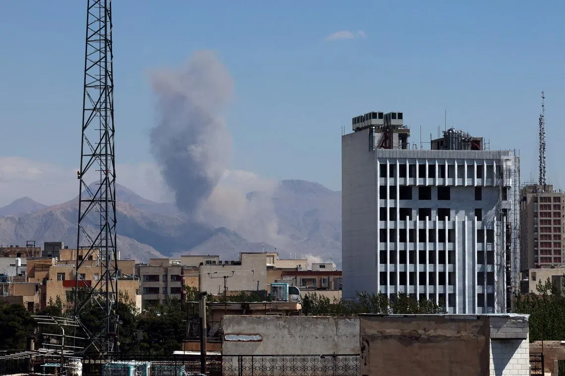 Smoke rises following a US-Israeli airstrike in Tehran, Iran, on April 7.