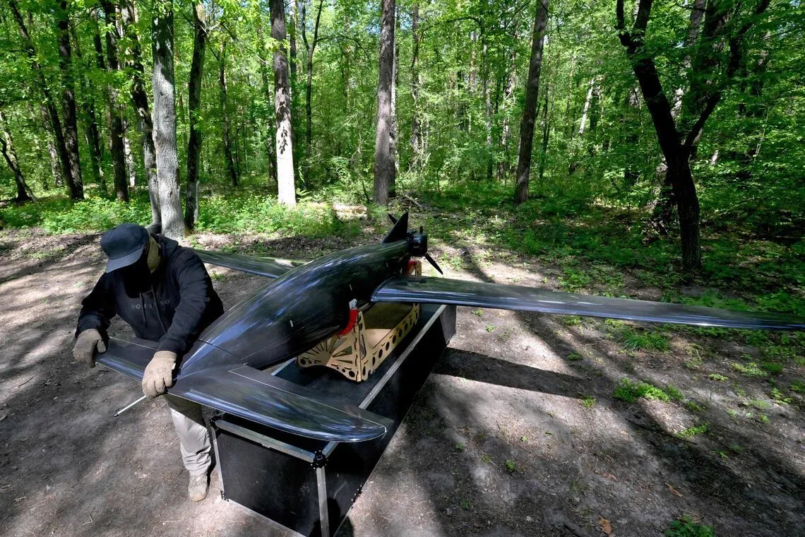 A Ukrainian soldier works on a “Beaver” drone engaged in deep strikes into Russian territory.
