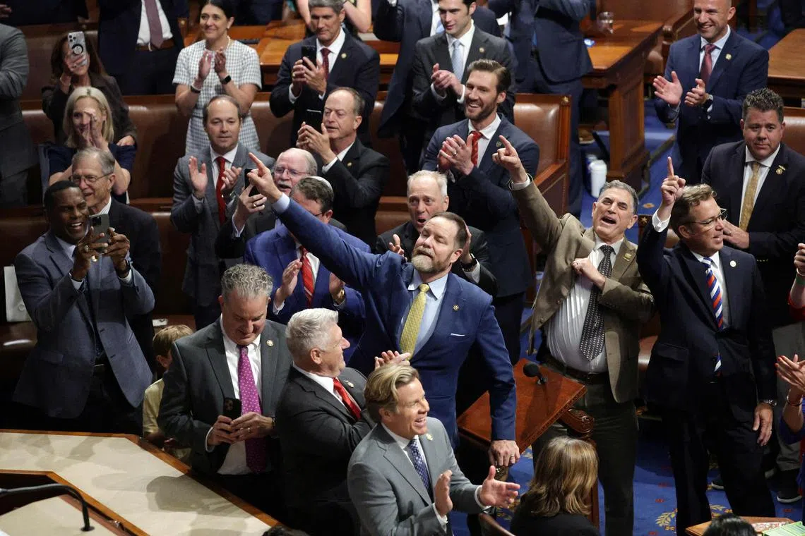 House Republicans celebrate as the House passed the sweeping tax and spending Bill after winning over fiscal hawks and moderate Republicans. 