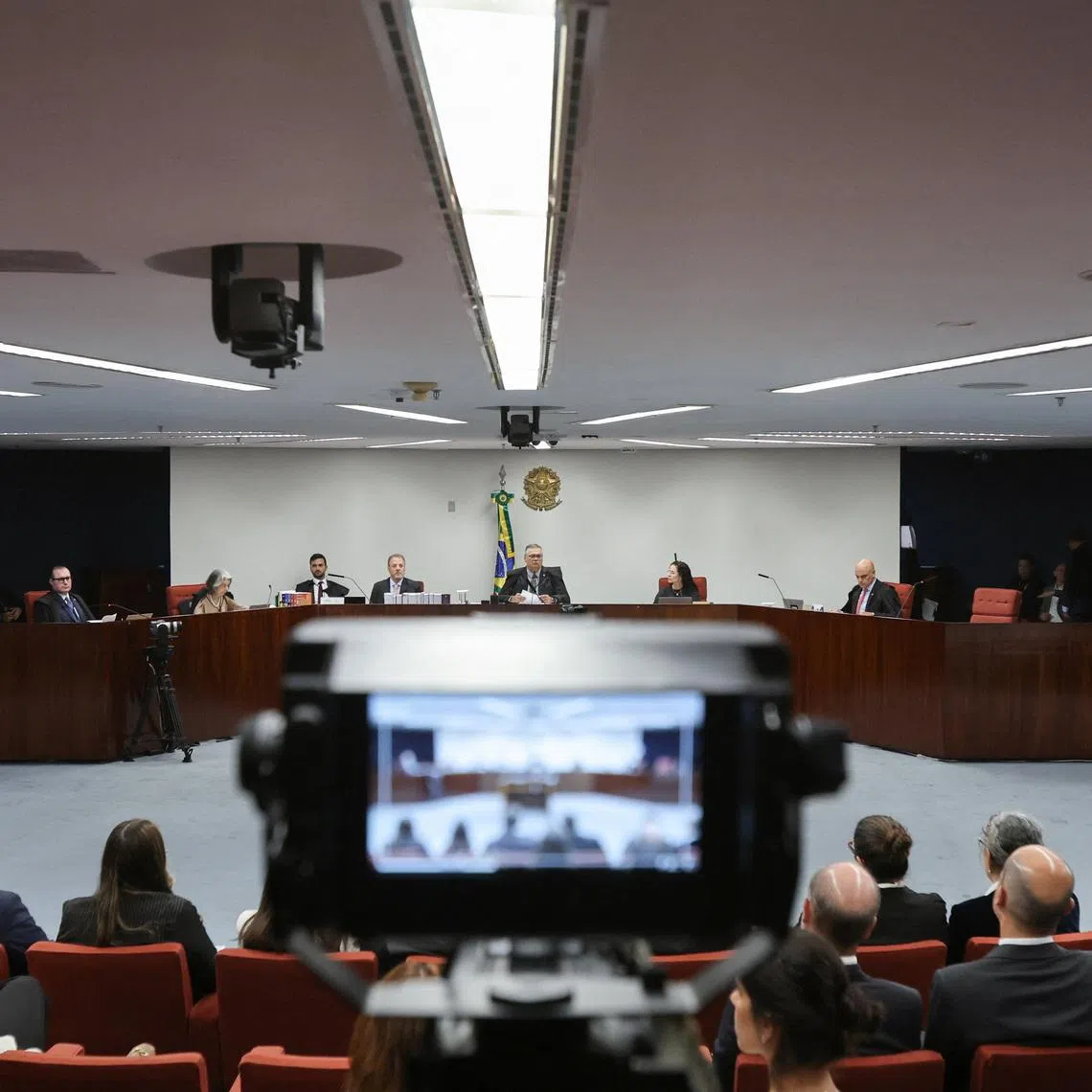 Brazil's Supreme Court Judges Flavio Dino and Alexandre de Moraes sit on the day of the first session of the trial of suspects accused of ordering the killing of Rio de Janeiro councilwoman Marielle Franco in 2018, at the Supreme Court in Brasilia, Brazil, February 24, 2026. REUTERS/Mateus Bonomi