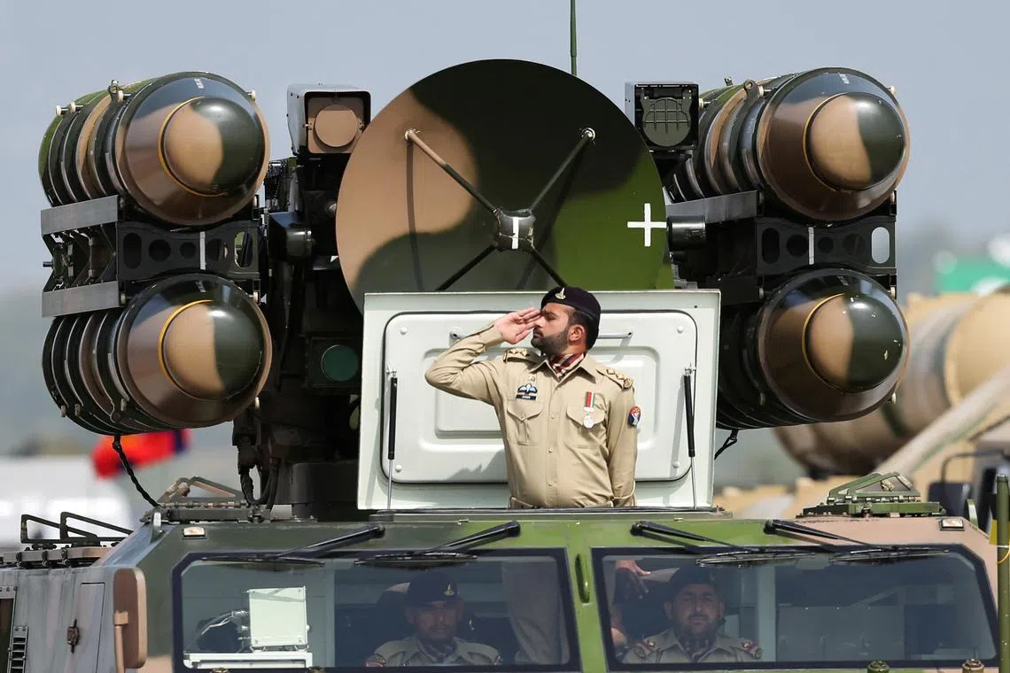 FILE PHOTO: Pakistani Army soldier salutes while standing on an air defence missile system during Pakistan Day military parade in Islamabad, Pakistan, March 23, 2022. REUTERS/Saiyna Bashir/File Photo