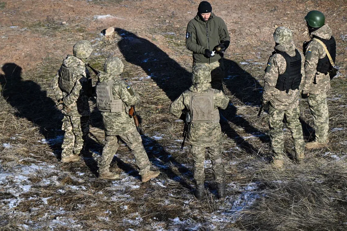 Ukrainian servicemen take part in a military training exercise in the Donetsk region of Ukraine.