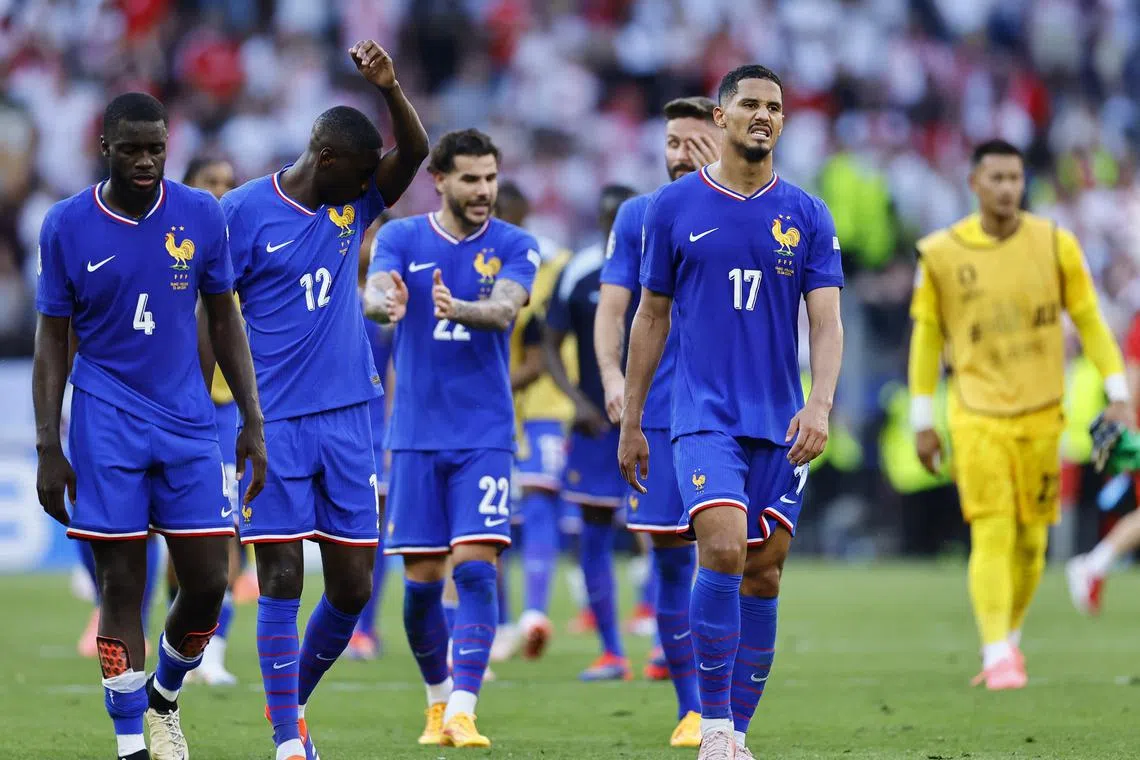 FILE PHOTO: Soccer Football - Euro 2024 - Group D - France v Poland - Dortmund BVB Stadion, Dortmund, Germany - June 25, 2024 France's William Saliba and Dayot Upamecano react after the match REUTERS/Leon Kuegeler/File Photo