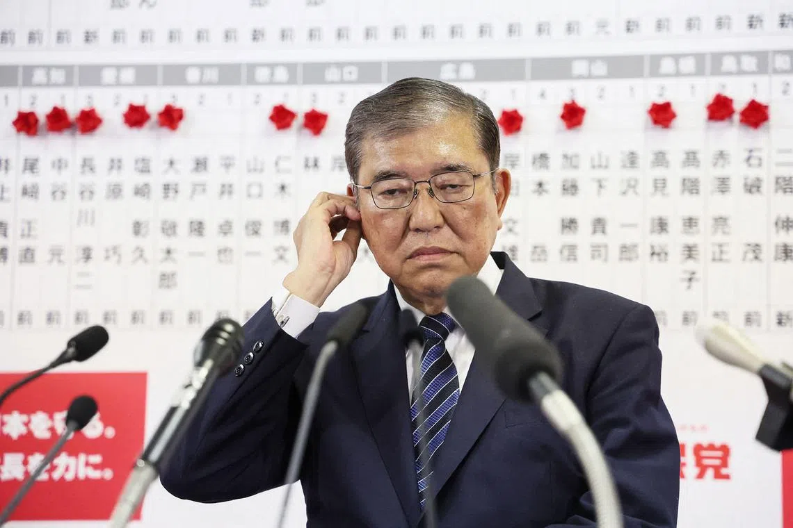 Japan's Prime Minister Shigeru Ishiba reacts during an interview at the Liberal Democratic Party headquarters after a general election on Oct 27, 2024.