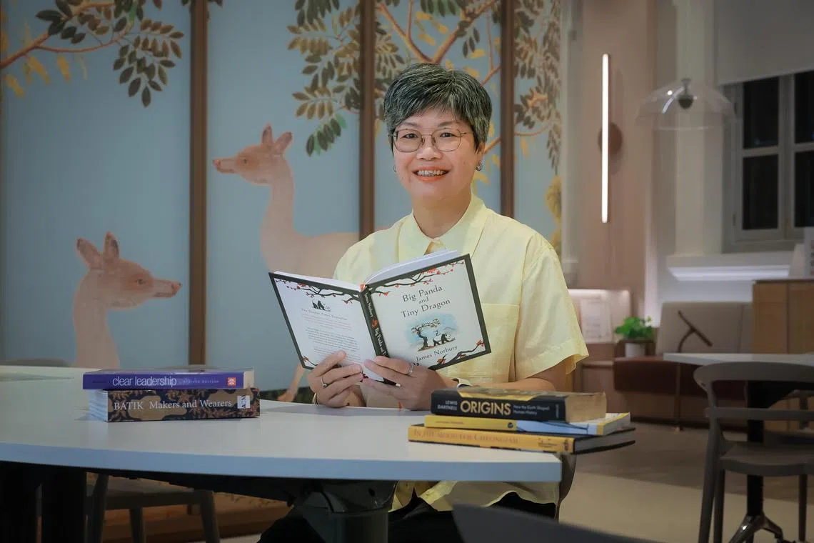 Chung May Khuen, director of the National Museum of Singapore, with her books that she is reading on Aug 28, 2024.