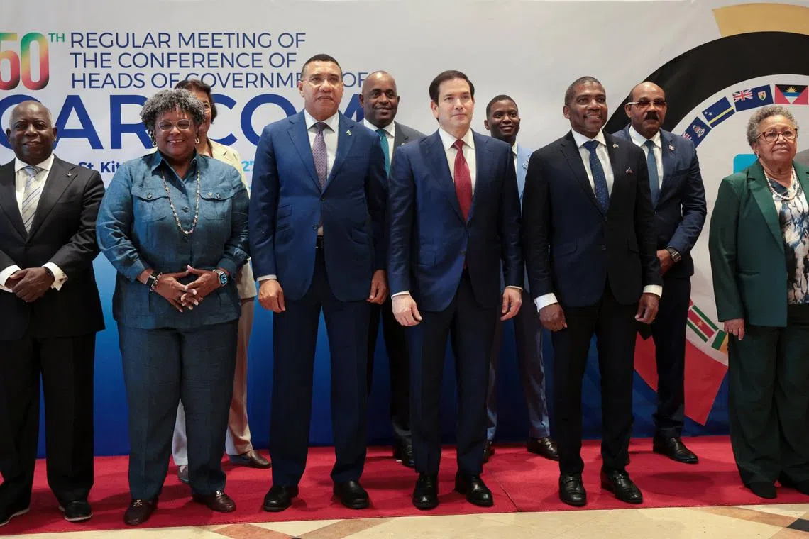 U.S. Secretary of State Marco Rubio poses for a family photo with Bahama's Prime Minister Philip Edward Davis, Grenada's Prime Minister Dickon Mitchell, Antigua and Barbuda's Prime Minister Gaston Browne, Barbados' Prime Minister Mia Amor Mottley, Jamaica's Prime Minister Andrew Holness and St. Kitts and Nevis Prime Minister Terrance Drew, alongside Caribbean Community (CARICOM) meetings, in Saint Kitts and Nevis, February 25, 2026. REUTERS/Jonathan Ernst/Pool