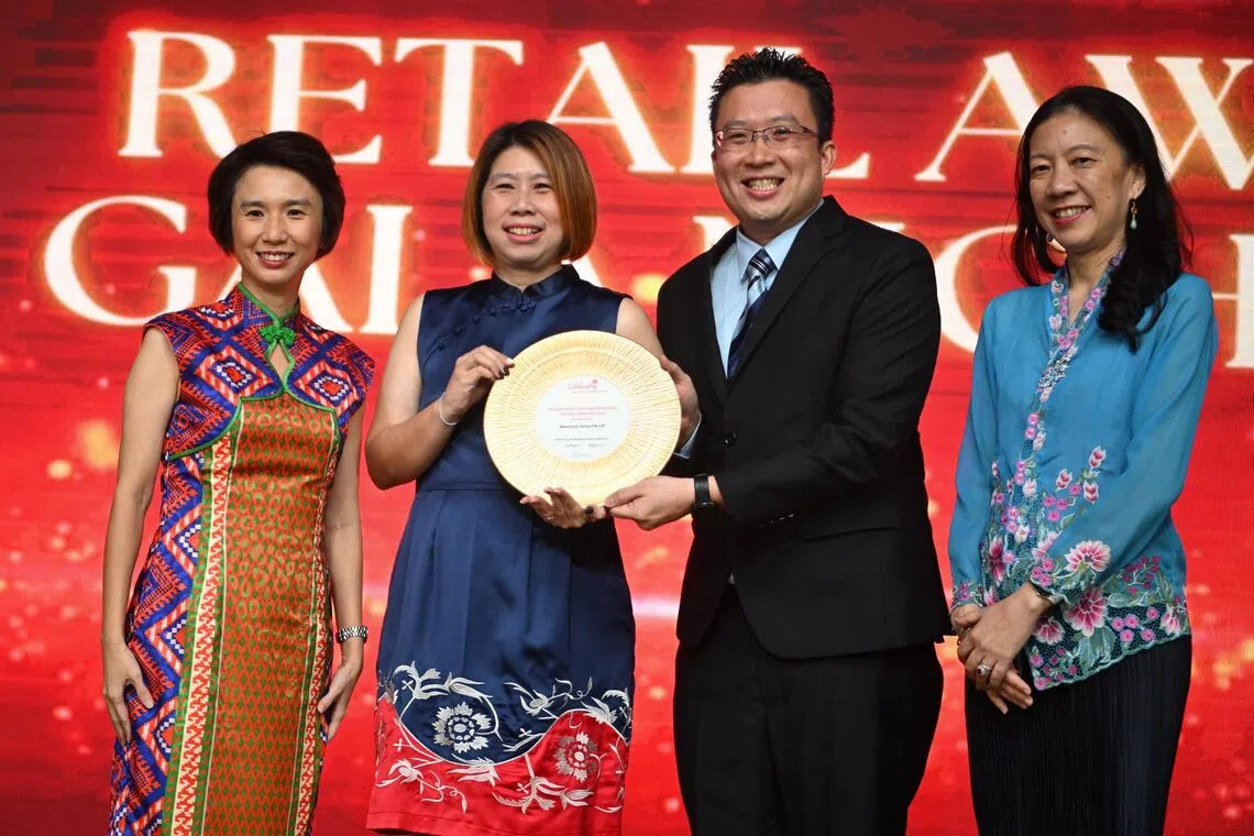 Senior Minister of State for Trade and Industry Low Yen Ling (left) and Workforce Singapore CEO Dilys Boey (right) presenting the Workforce Transformation Award to Ms Jocelyn Chan, director of human resources and business excellence at Aspial Corporation, and Mr Oh Kwok Fon, assistant finance director for Aspial.