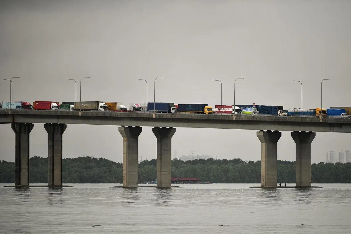 Heavy vehicles, lorries and vans carrying goods entering Singapore via the Second Link bridge.