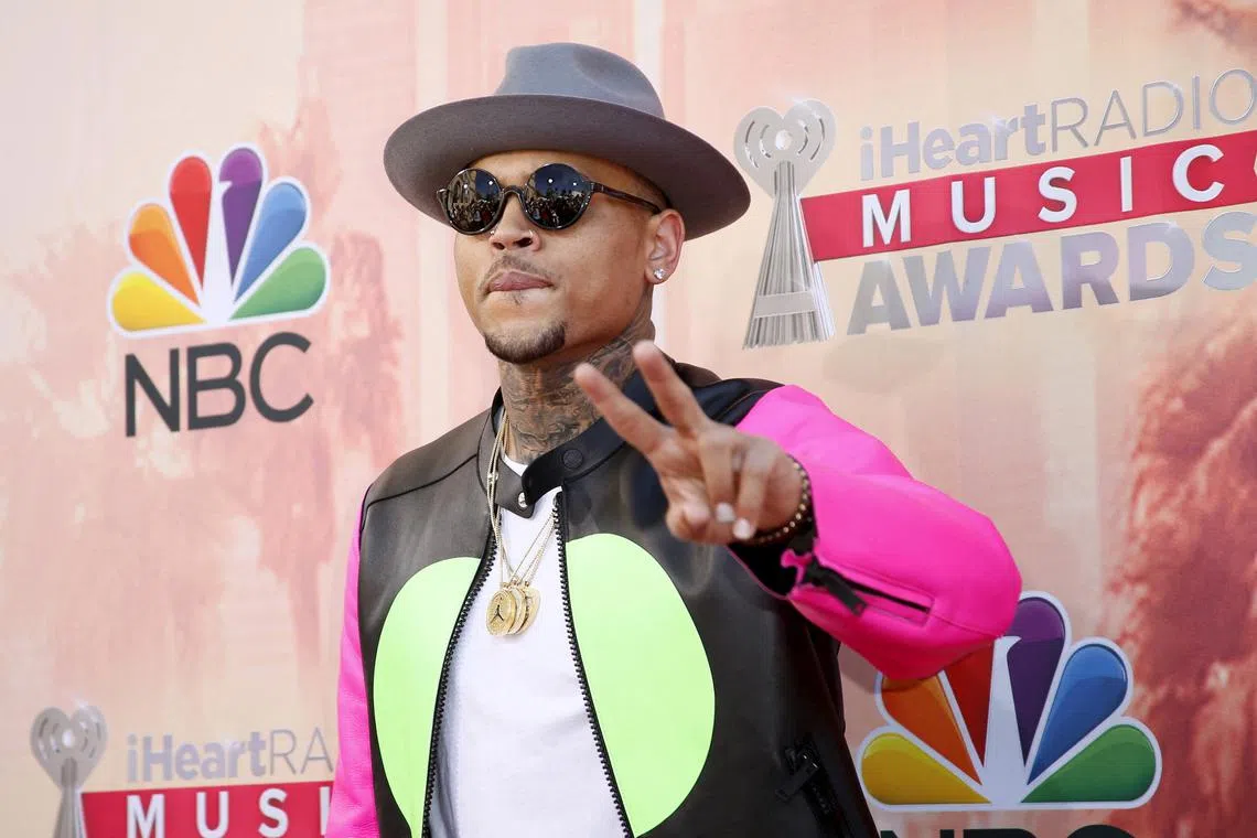 FILE PHOTO: Singer Chris Brown poses at the 2015 iHeartRadio Music Awards in Los Angeles, California, March 29, 2015. REUTERS/Danny Moloshok/File Photo