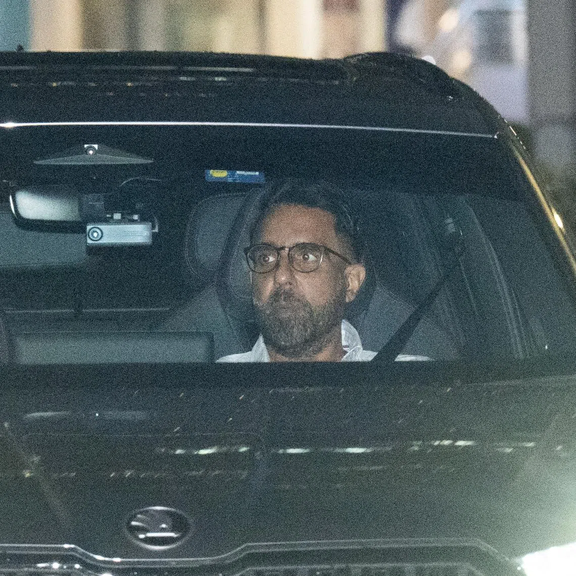 WP chief Pritam Singh and his wife leaving Parliament House on Jan 14.