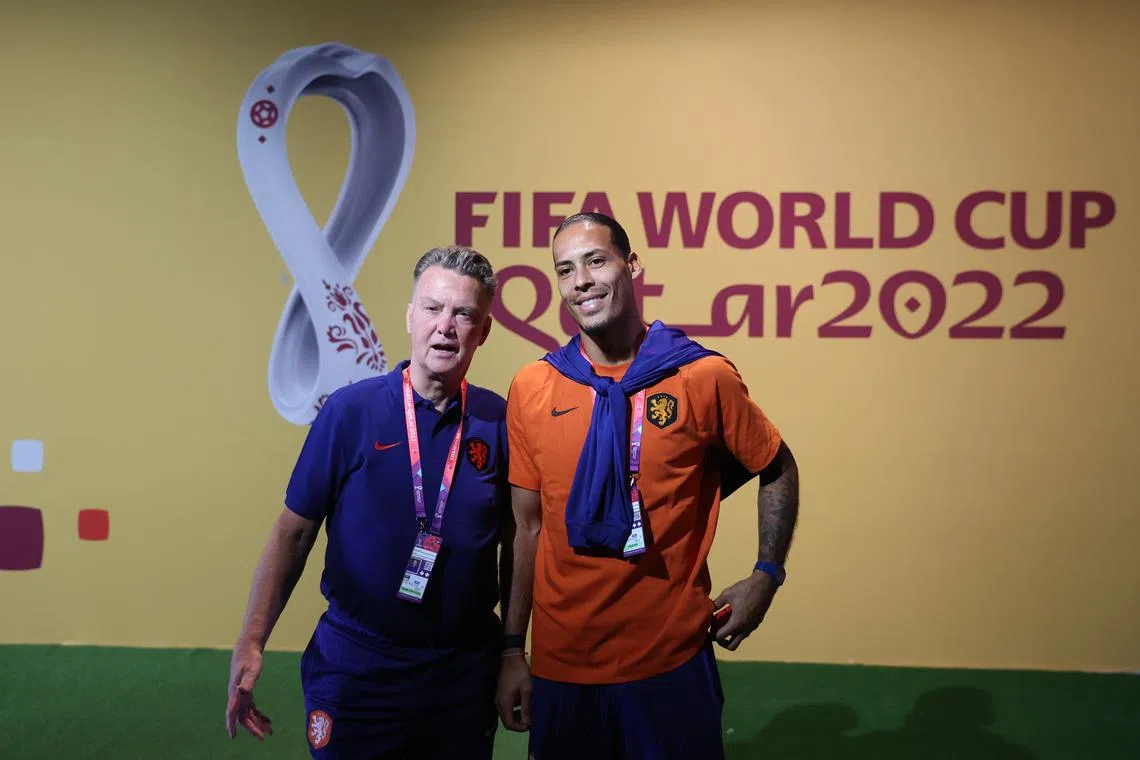 Netherlands coach Louis van Gaal (left) and Virgil van Dijk speaking ahead of their side's World Cup Group A clash with Senegal on Monday.