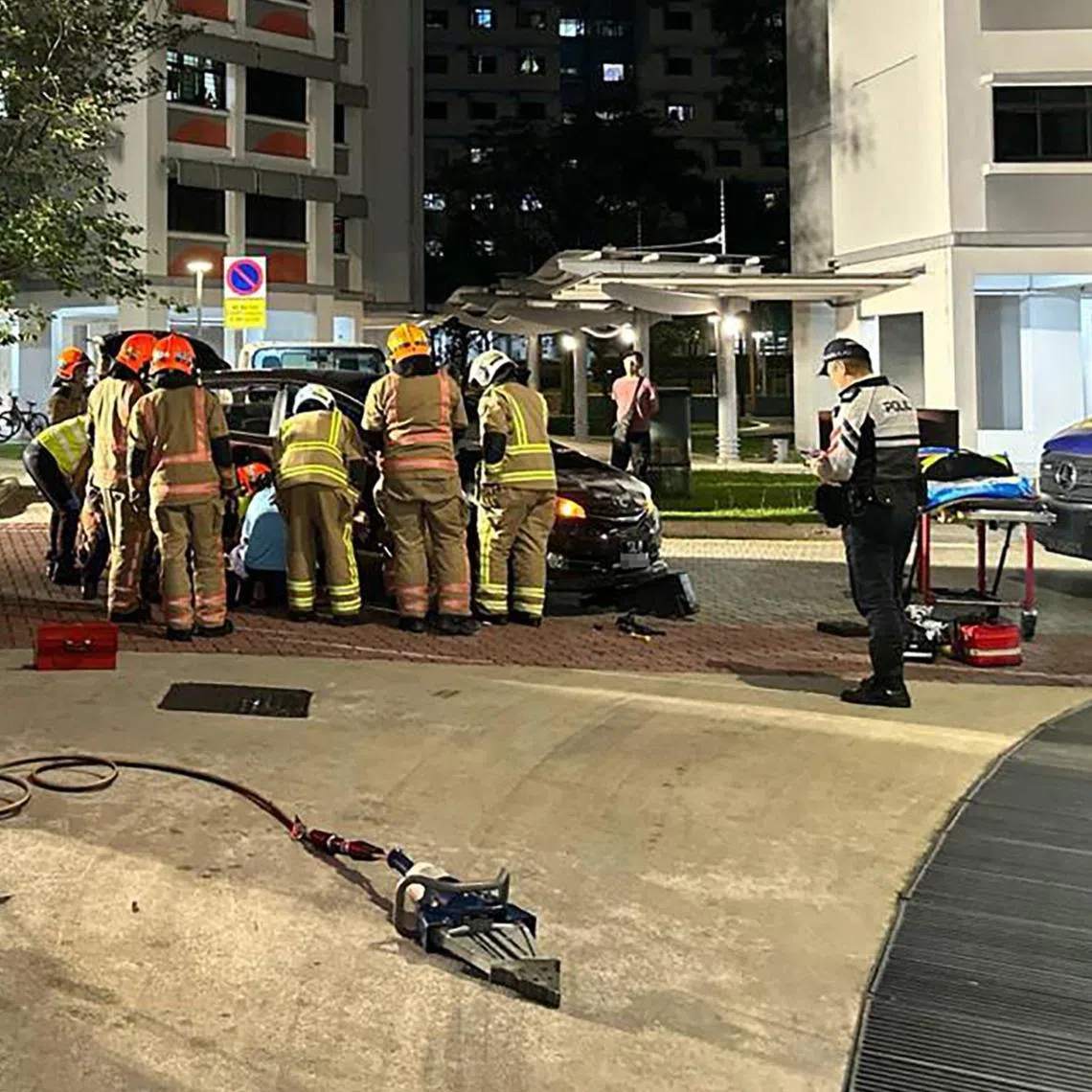 SCDF officers found the woman’s leg trapped between the fender and the tyre of a car.
