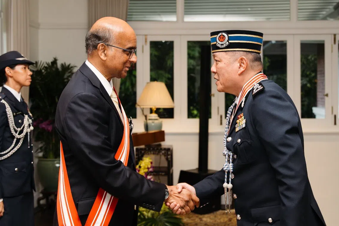 President Mr Tharman Shanmugaratnam confers the Distinguished Service Order on Commissioner of Police of the Royal Brunei Police Force Mohammad Irwan Haji Hambali at the Istana on Oct 15.