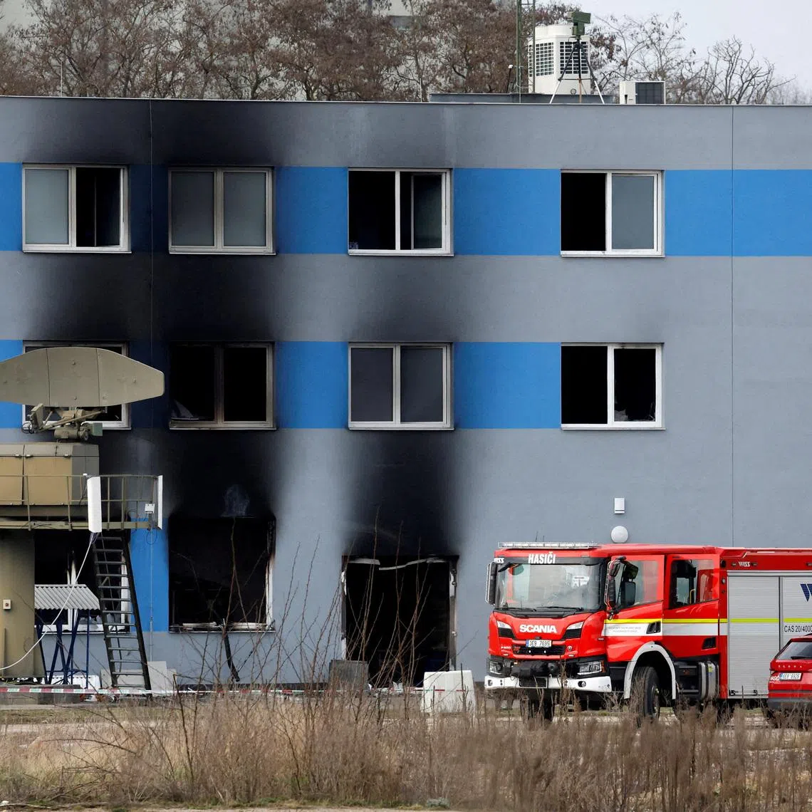 FILE PHOTO: A firetruck stands in front of a burned production hall at an industrial area in Pardubice, Czech Republic, March 20, 2026. REUTERS/David W Cerny/File Photo
