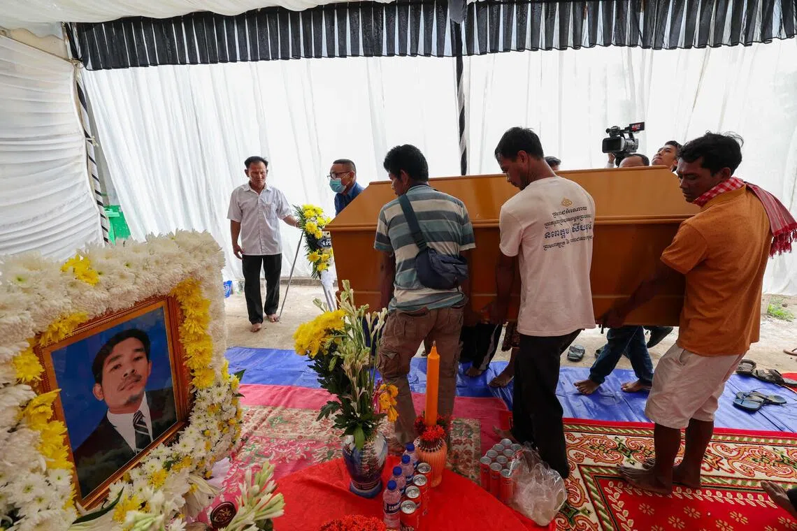 People carrying the coffin of a civilian killed along the Cambodia-Thailand border, amid accusations from both sides on Nov 12 of fresh clashes.