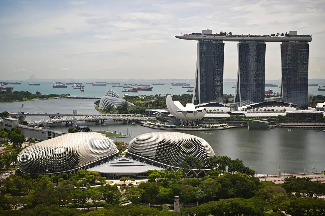 View of Esplanade, Marina Bay Sands and ships anchored off Marina Bay, 27 October 2022. Can be used for stories on money, property, land, tourist, tourism, commercial, budget, income, port