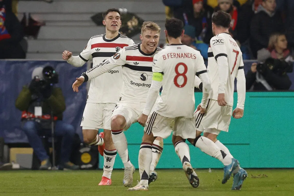 Manchester United's Rasmus Hojlund celebrates scoring their second goal with teammates.