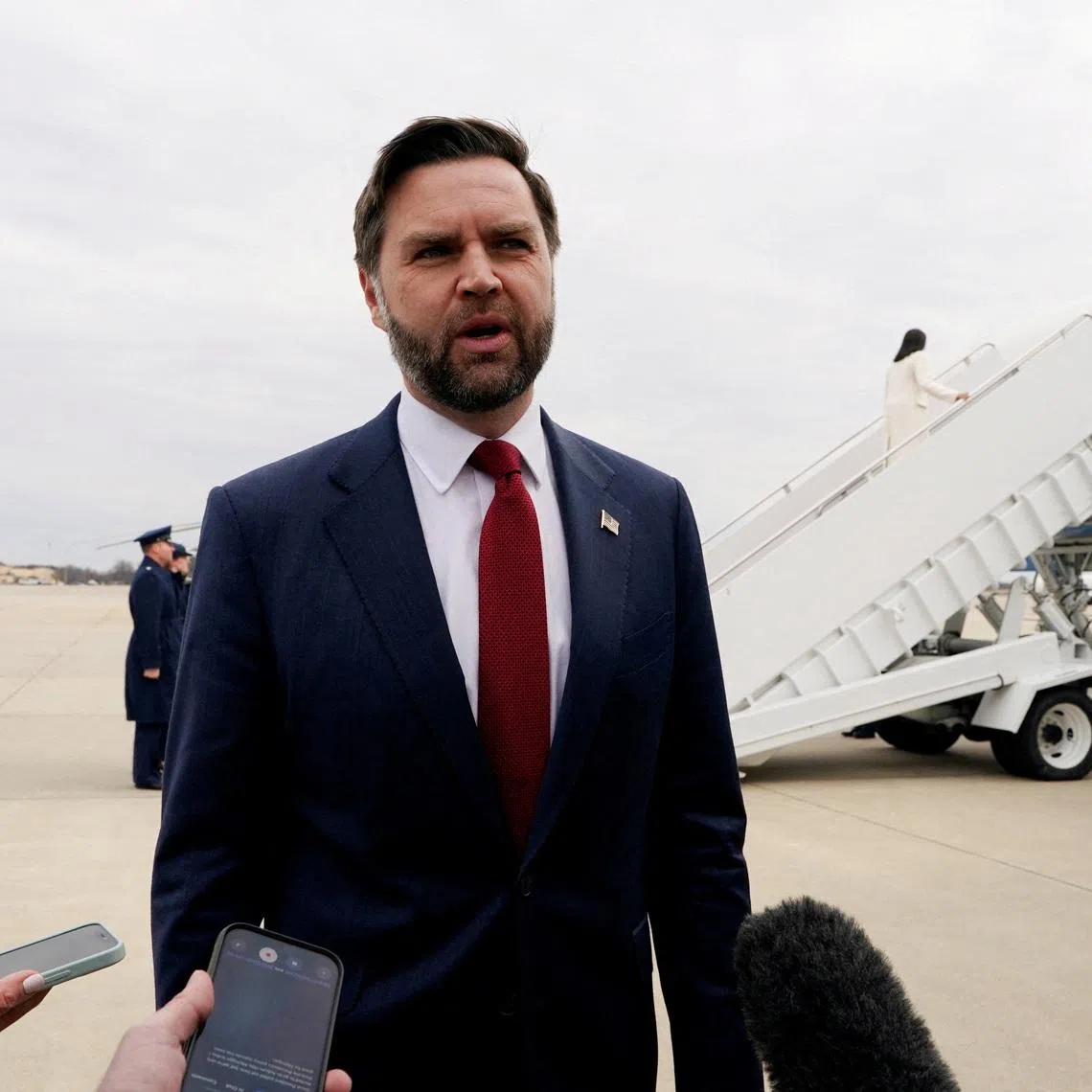 FILE PHOTO: U.S. Vice President JD Vance speaks to mebers of the media as he travels to Michigan, at Joint Base Andrews, Maryland, U.S., on Wednesday, March 18, 2026. Elizabeth Frantz/Pool via REUTERS/File Photo
