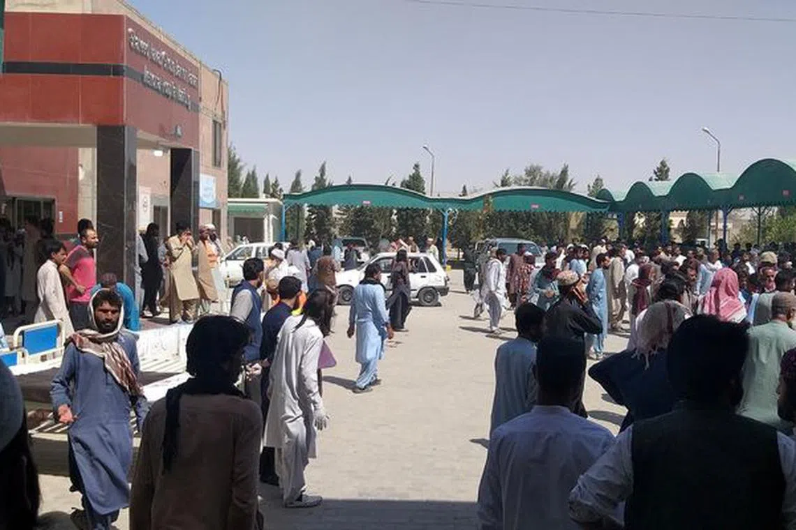 People gather outside the Mastung hospital, following a deadly suicide attack on a religious gathering in Balochistan province, Pakistan, September 29, 2023 in this handout image. Shaheed Nawab Ghous Bakhsh Raisani Memorial Hospital Mastung/Handout via REUTERS